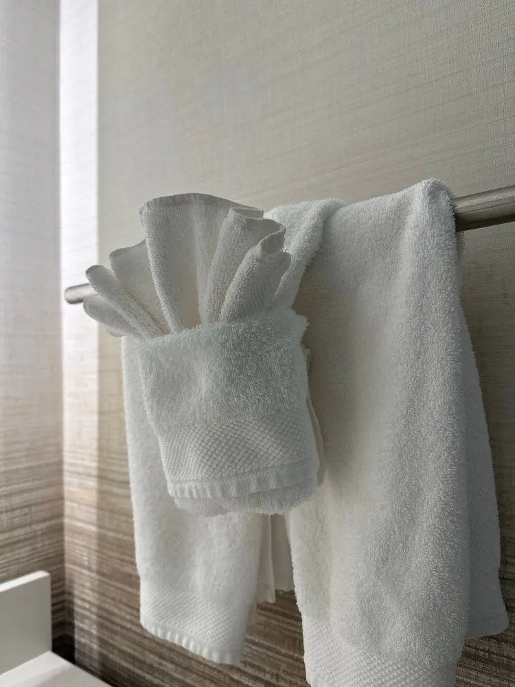 White towels arranged in a modern bathroom